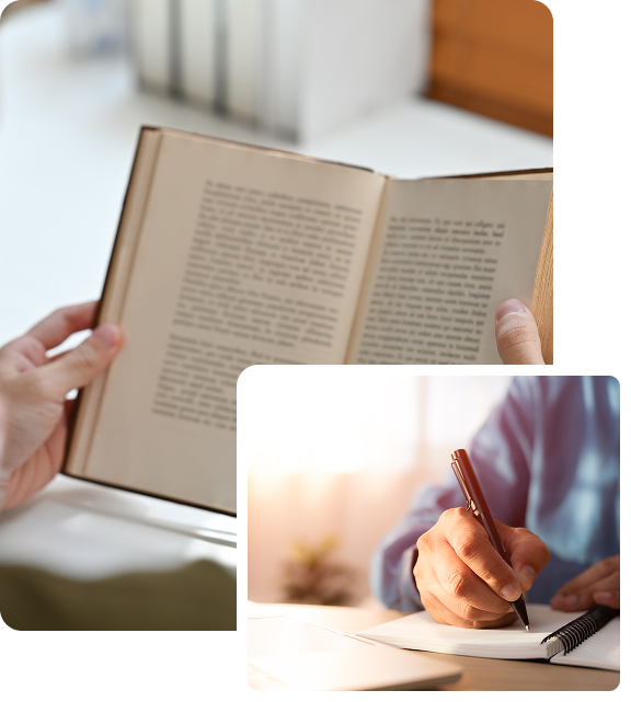 Person reading book and writing notes.