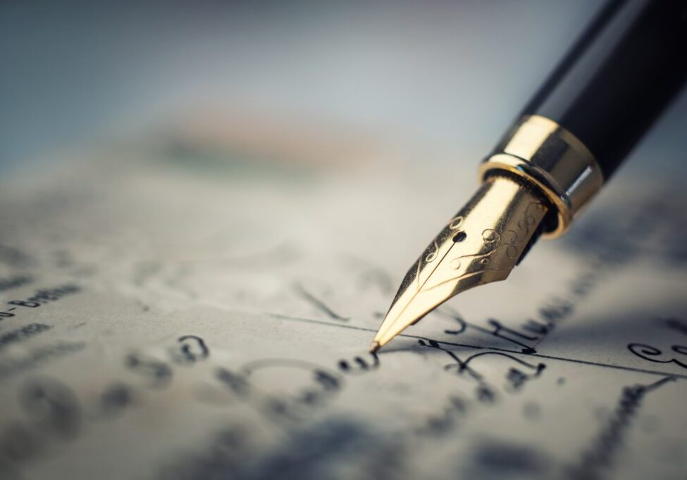 Fountain pen writing on a handwritten letter.